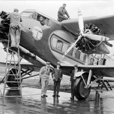 Six men pose with a Boeing 80A at Omaha Municipal Airport, June 5, 1930.