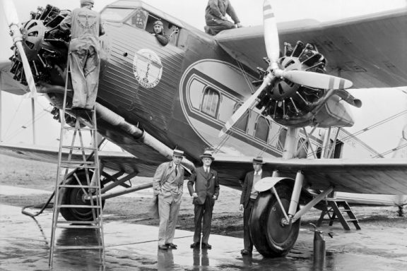 Six men pose with a Boeing 80A at Omaha Municipal Airport, June 5, 1930.