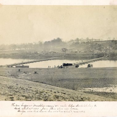 A vintage photo of a bridge over a river