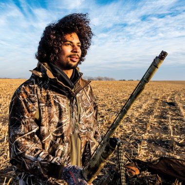 man hunting in corn field