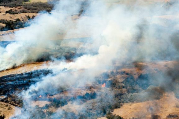 Aerial view of prescribed fires across the landscape to control eastern redcedar.