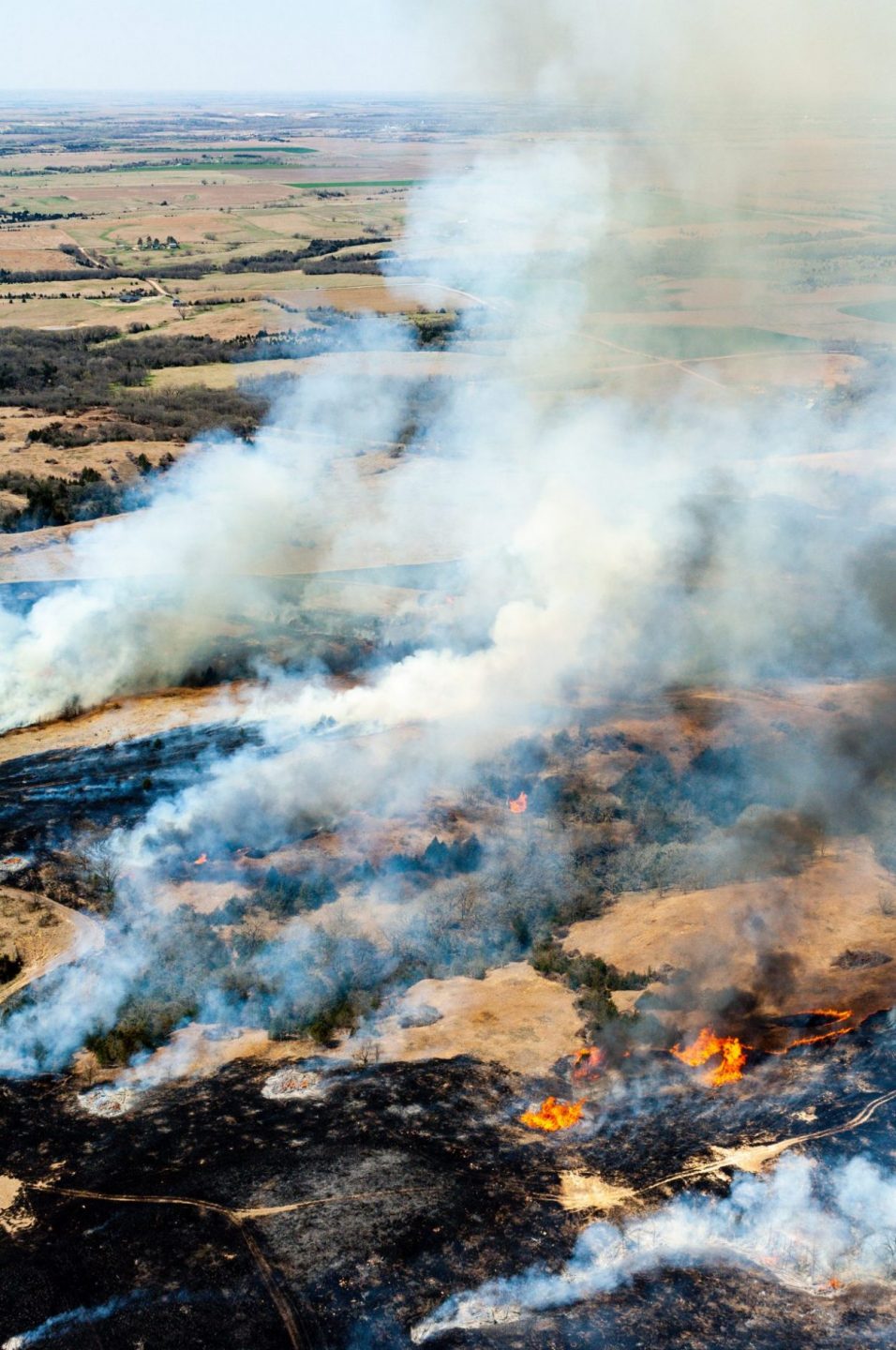 Aerial view of prescribed fires across the landscape to control eastern redcedar.