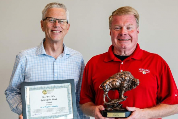 Nebraska Game and Parks Commission Director Tim McCoy presenting the Midwest Fish & Wildlife Agencies’ Spirit of the Shack Achievement Award to Greg Wagner.