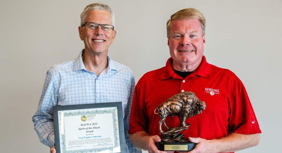 Nebraska Game and Parks Commission Director Tim McCoy presenting the Midwest Fish & Wildlife Agencies’ Spirit of the Shack Achievement Award to Greg Wagner.