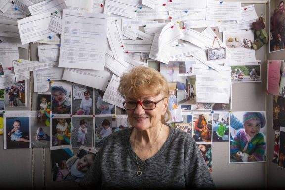 CJ Zajicek poses in her office where she works as the Parks Reservation Call Center for Nebraska Game and Parks.