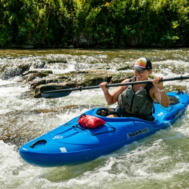 A woman kayaks down a shoot on the Niobrara River.