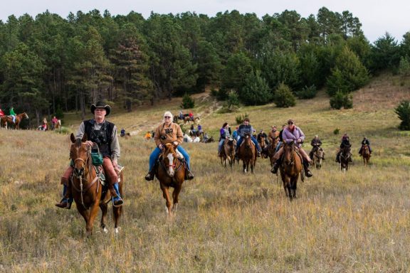 Horseback riders trail riding at the Nebraska National Forest at Halsey.