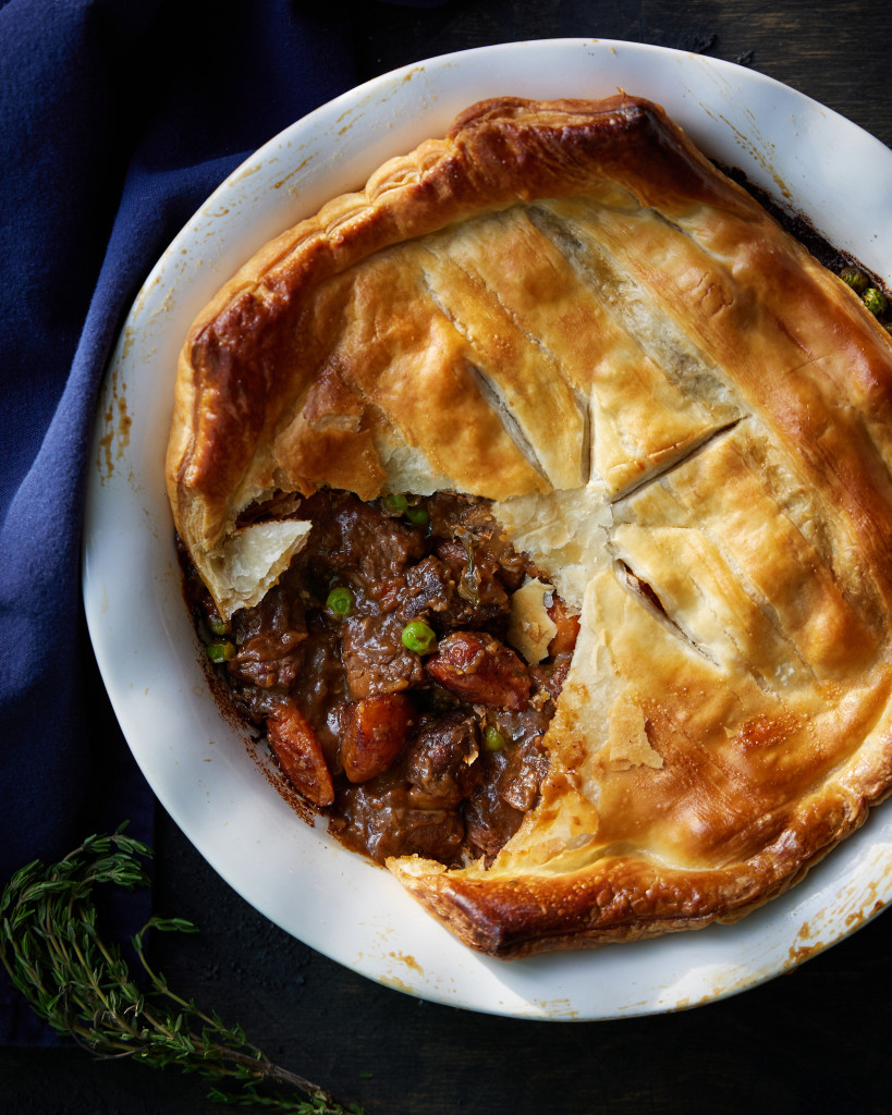 Venison and vegetable-filled pot pie with puff pastry.