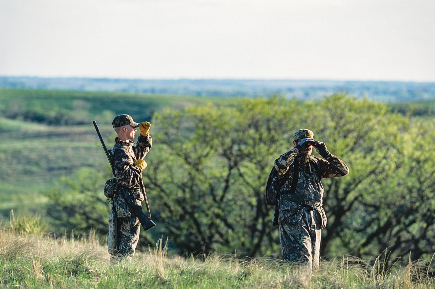 Two men hunting turkeys.