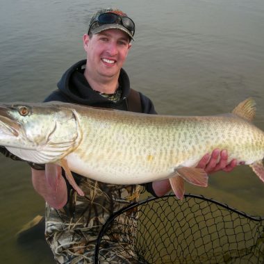 An angler holds a large muskie caught in Nebraska.