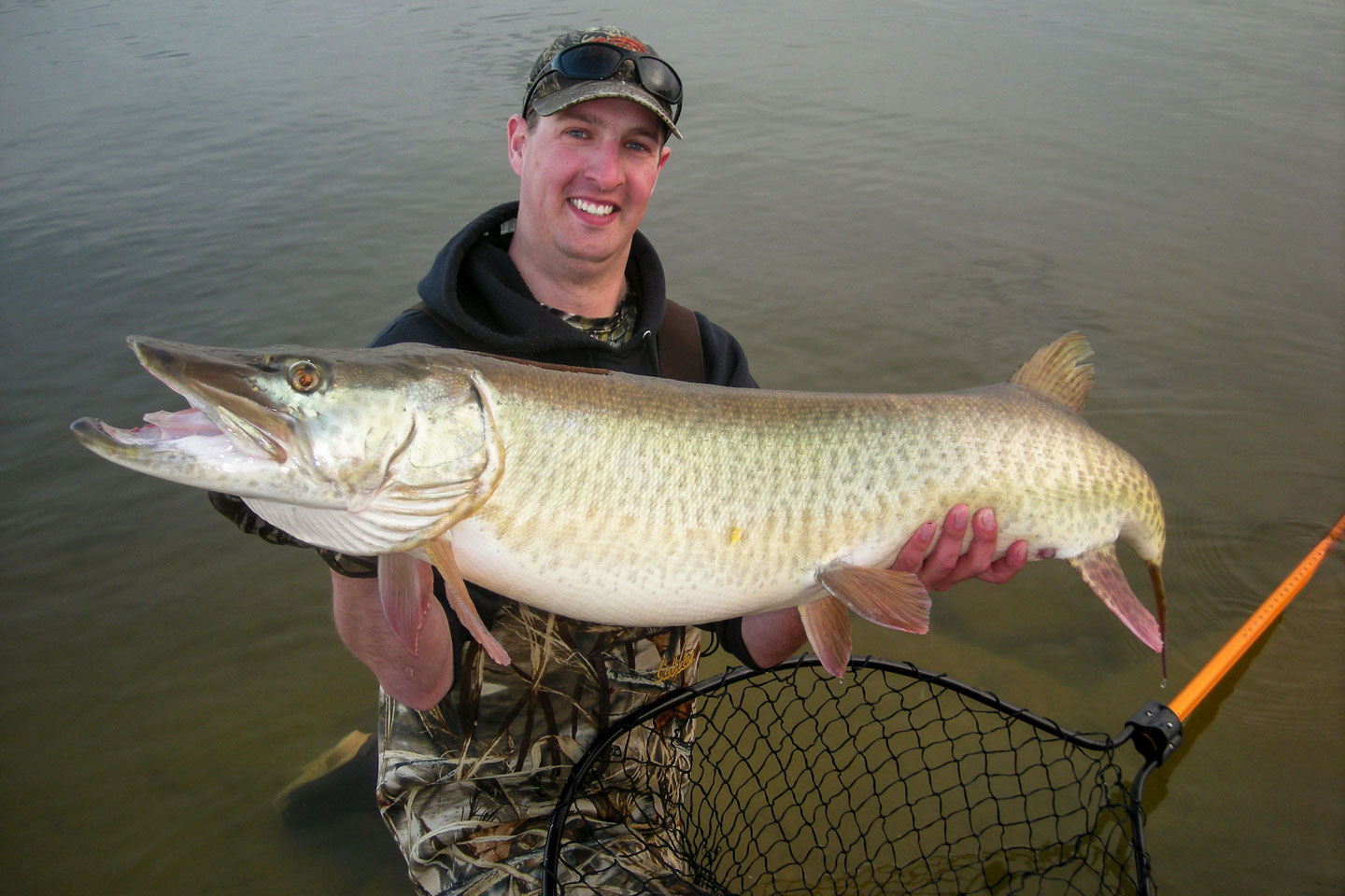 An angler holds a large muskie caught in Nebraska.